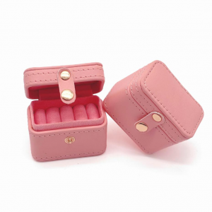 This sturdy cubic leather jewelry box is perfect for short trips—compact, durable, and stylish.
